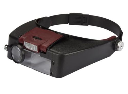 Повязка на голову с увеличительным стеклом и светодиодной панелью.