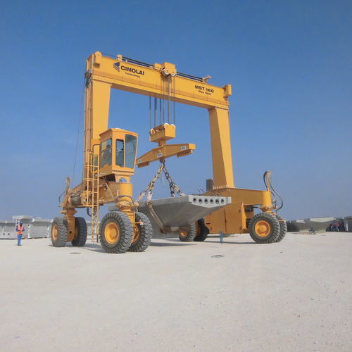 Rubber-tired straddle carrier MST 160for precast beams