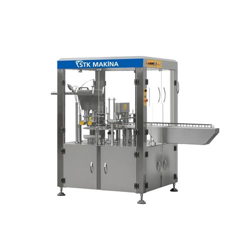 Container filling machine for dairy productsfor the food industry