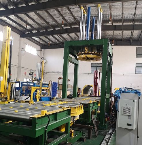 Automatic strapping machine for wire coilscompacting