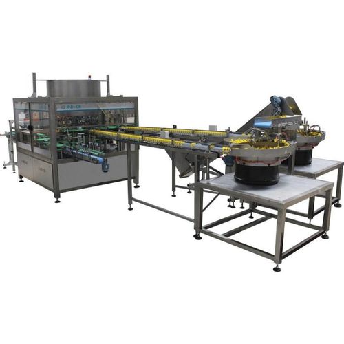 Automatic handle applicator SIAP24000with conveyorfor bottlescontinuous-motion