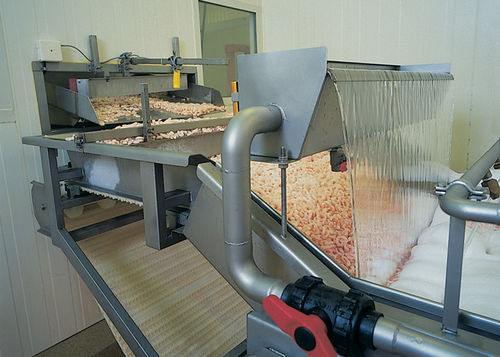 Машина для погружного оттаивания рыбы и креветок непрерывного действия.